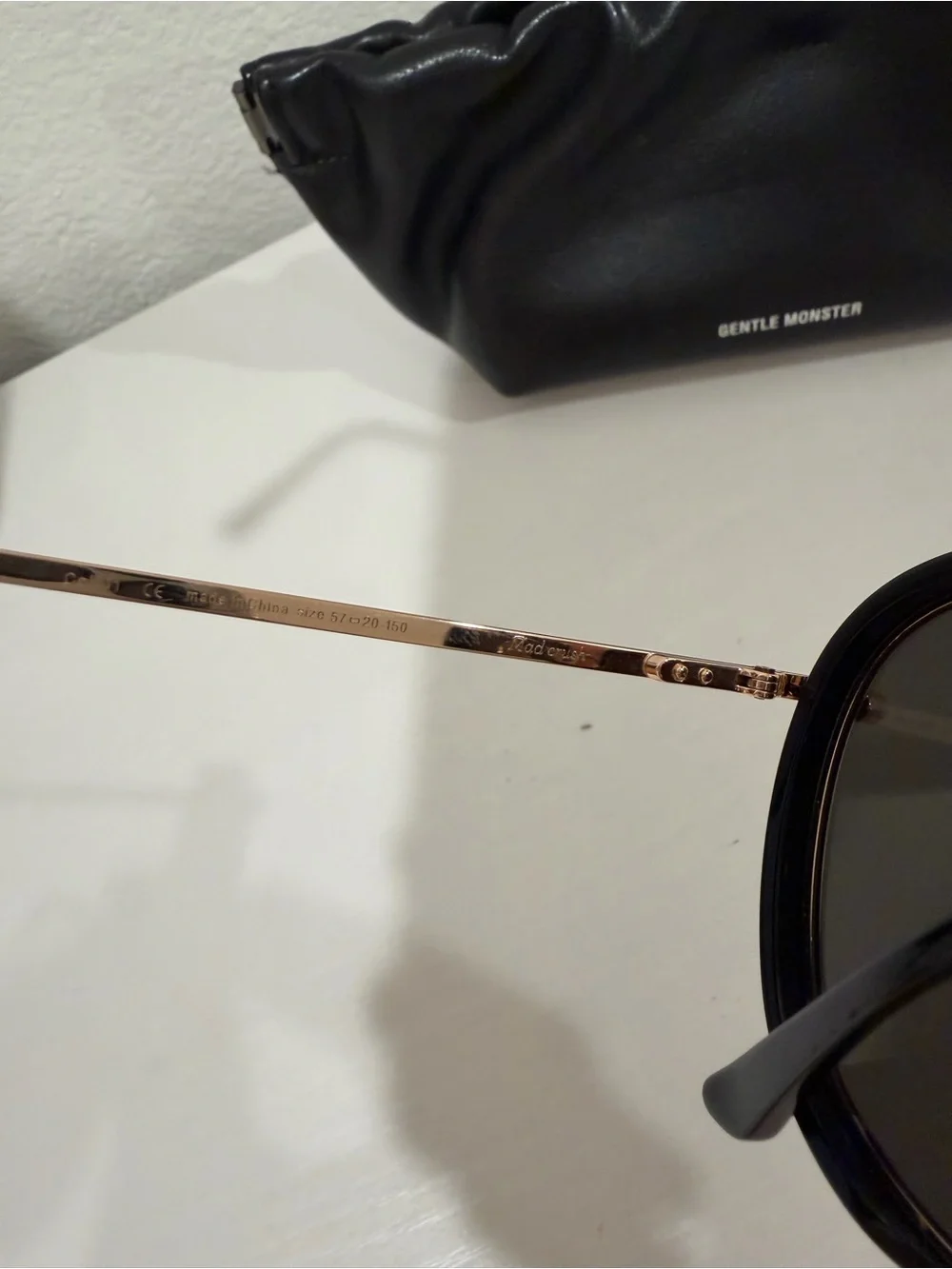 GENTLE MONSTER Black and Gold Round Sunglasses